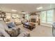 Finished basement with fireplace, comfortable seating, and kitchenette at 990 Bramlett Shoals Rd, Lawrenceville, GA 30045