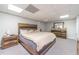 King-size bed in a finished basement bedroom at 990 Bramlett Shoals Rd, Lawrenceville, GA 30045