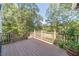 Deck overlooks scenic backyard with lush greenery at 990 Bramlett Shoals Rd, Lawrenceville, GA 30045