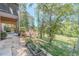 Landscaped backyard with stone path, garden, and wooded area at 990 Bramlett Shoals Rd, Lawrenceville, GA 30045