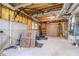 Unfinished basement with exposed utilities and potential for customization at 990 Bramlett Shoals Rd, Lawrenceville, GA 30045