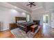 Bright main bedroom with hardwood floors and en-suite bathroom access at 990 Bramlett Shoals Rd, Lawrenceville, GA 30045