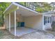 Covered carport with concrete flooring and brick walls at 772 Jefferson Sw Ave, Atlanta, GA 30315
