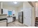 Modern kitchen with white cabinets, granite counters and stainless steel appliances at 772 Jefferson Sw Ave, Atlanta, GA 30315
