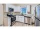Updated kitchen, featuring stainless steel appliances and granite countertops at 772 Jefferson Sw Ave, Atlanta, GA 30315