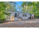 Ranch style home with gray brick exterior and two wooden staircases at 772 Jefferson Sw Ave, Atlanta, GA 30315