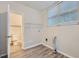 Bright laundry room with washer/dryer hookups, built-in shelving, and toilet at 772 Jefferson Sw Ave, Atlanta, GA 30315