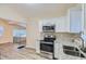 Eat-in kitchen with stainless steel appliances and granite countertops at 772 Jefferson Sw Ave, Atlanta, GA 30315