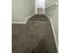 Carpeted stairs leading down to the basement at 330 Winding River Dr # B, Atlanta, GA 30350