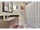 Modern bathroom with dark vanity and shower/tub combo at 222 12Th Ne St # 1902, Atlanta, GA 30309