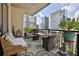 Relaxing balcony with city views and outdoor furniture at 222 12Th Ne St # 1902, Atlanta, GA 30309