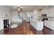 Open concept living room and kitchen with hardwood floors and fireplace at 51 S Auburn Landing Pl # 51, Auburn, GA 30011