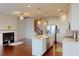 Open concept kitchen and living room with hardwood floors and fireplace at 51 S Auburn Landing Pl # 51, Auburn, GA 30011