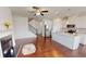 Kitchen features white cabinets, island, and hardwood floors at 51 S Auburn Landing Pl # 51, Auburn, GA 30011