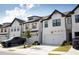 Modern townhouses with two-car garages and landscaping at 51 S Auburn Landing Pl # 51, Auburn, GA 30011
