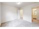 Well-lit bedroom with carpet and access to a private bathroom at 51 S Auburn Landing Pl # 51, Auburn, GA 30011