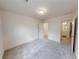 Spacious bedroom with carpeted floor and access to bathroom at 51 S Auburn Landing Pl # 51, Auburn, GA 30011