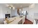 Open concept kitchen and living room with hardwood floors and fireplace at 51 S Auburn Landing Pl # 51, Auburn, GA 30011