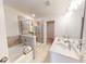 Bathroom with shower, tub, and double vanity at 51 S Auburn Landing Pl # 51, Auburn, GA 30011