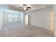 Spacious bedroom with carpeted floor, ceiling fan, and large window at 51 S Auburn Landing Pl # 51, Auburn, GA 30011