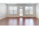 Living room with hardwood floors and sliding glass doors at 51 S Auburn Landing Pl # 51, Auburn, GA 30011