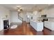 Open concept living room and kitchen with hardwood floors and fireplace at 51 S Auburn Landing Pl # 51, Auburn, GA 30011