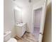 Bathroom with white vanity, toilet, and shower/tub combo at 51 S Auburn Landing Pl # 51, Auburn, GA 30011
