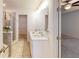 Double vanity bathroom with a large mirror and a walk-in shower at 51 S Auburn Landing Pl # 51, Auburn, GA 30011