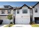 Modern two-story townhome with white exterior at 51 S Auburn Landing Pl # 51, Auburn, GA 30011