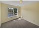 Well-lit bedroom featuring a large window and neutral decor at 265 Simonton Crest Dr, Lawrenceville, GA 30045