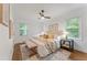 Spacious bedroom with hardwood floors and a ceiling fan at 1215 Richland Sw Rd, Atlanta, GA 30310