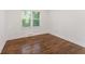 Simple bedroom with hardwood floors and neutral walls at 1215 Richland Sw Rd, Atlanta, GA 30310