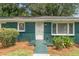 Green brick ranch house with front porch at 1215 Richland Sw Rd, Atlanta, GA 30310