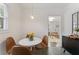 Bright dining area with a round table and four brown leather chairs at 1215 Richland Sw Rd, Atlanta, GA 30310