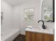 Modern bathroom with white subway tile and hexagon floor tile at 1215 Richland Sw Rd, Atlanta, GA 30310