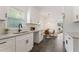 Modern kitchen with white cabinets, granite countertops, and a breakfast nook at 1215 Richland Sw Rd, Atlanta, GA 30310