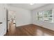 Well-lit bedroom with hardwood floors and access to hallway at 1215 Richland Sw Rd, Atlanta, GA 30310