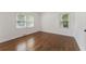 Spacious bedroom featuring hardwood floors and ample natural light at 1215 Richland Sw Rd, Atlanta, GA 30310