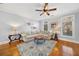 Living room with hardwood floors and large windows at 222 Le Gran Vw, Atlanta, GA 30328