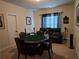 Finished basement game room with a poker table and comfortable seating at 6856 Louis Dr, Locust Grove, GA 30248