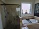 Bathroom with a large walk-in shower and an oval soaking tub at 6856 Louis Dr, Locust Grove, GA 30248