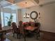 Elegant dining room with a large table, chandelier, and hardwood floors at 6856 Louis Dr, Locust Grove, GA 30248