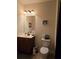 Small bathroom with a single vanity, toilet, and shower/tub combination at 6856 Louis Dr, Locust Grove, GA 30248