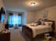 Bright and airy bedroom with a comfortable bed and plenty of closet space at 6856 Louis Dr, Locust Grove, GA 30248