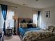 Guest bedroom with a comfortable bed, and plenty of natural light at 6856 Louis Dr, Locust Grove, GA 30248