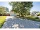 Long driveway leading to a two-car garage, with a large tree to one side at 3540 Owl Brow Ct, Cumming, GA 30028