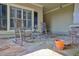 Inviting front porch with stone flooring and rocking chairs at 202 Briarwood Ln, Canton, GA 30114