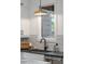 Modern kitchen with farmhouse sink and black faucet at 10858 Serenbe Ln, Chattahoochee Hills, GA 30268