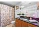 Bathroom with granite vanity and floral shower curtain at 3300 Windy Ridge Se Pkwy # 1110, Atlanta, GA 30339