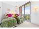 Twin bedroom with green bedding and balcony access at 3300 Windy Ridge Se Pkwy # 1110, Atlanta, GA 30339